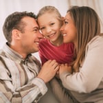 Family hugging each other. Article: Is A Furnace Tune Up Worth It & What Does It Consist Of?