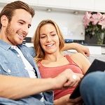 couple-looking-at-spring-maintenance-guide